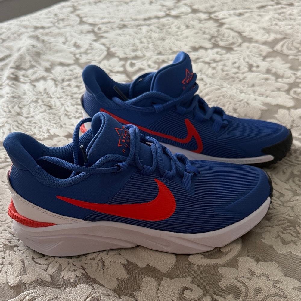 Nike Blue Athletic Sneakers with Red Swoosh
